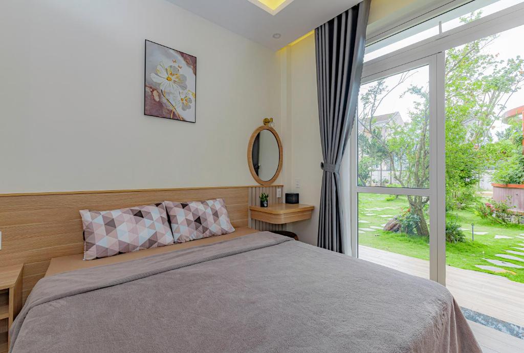 Giường trong phòng chung tại An Mai Boutique Hotel