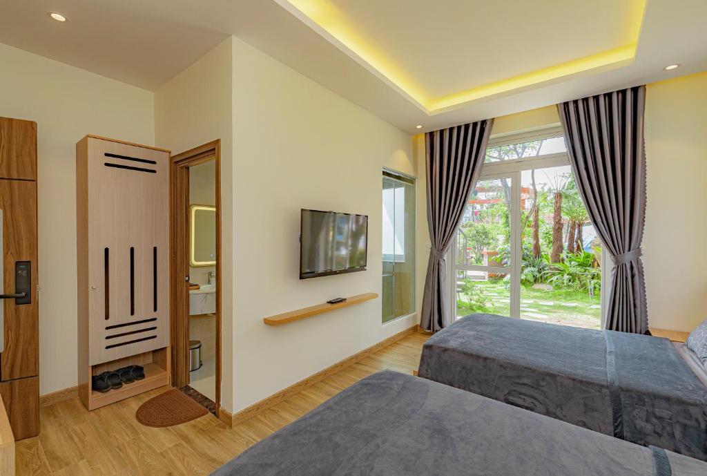 Giường trong phòng chung tại An Mai Boutique Hotel