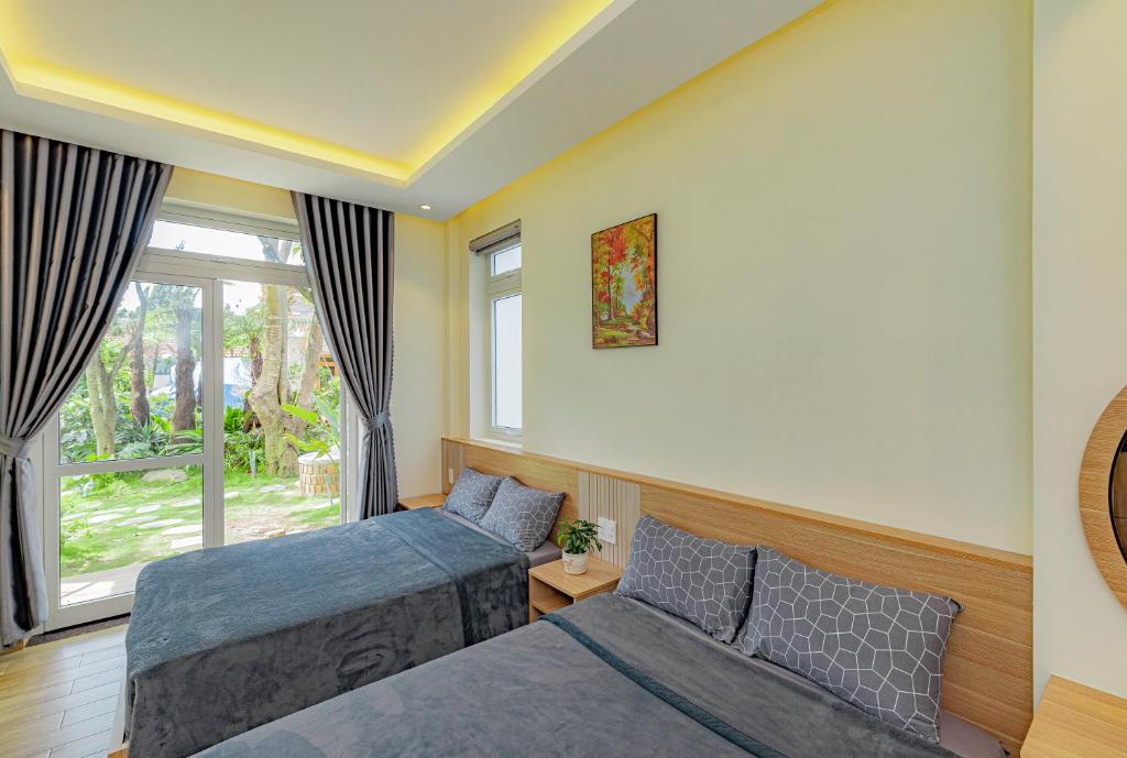 Giường trong phòng chung tại An Mai Boutique Hotel
