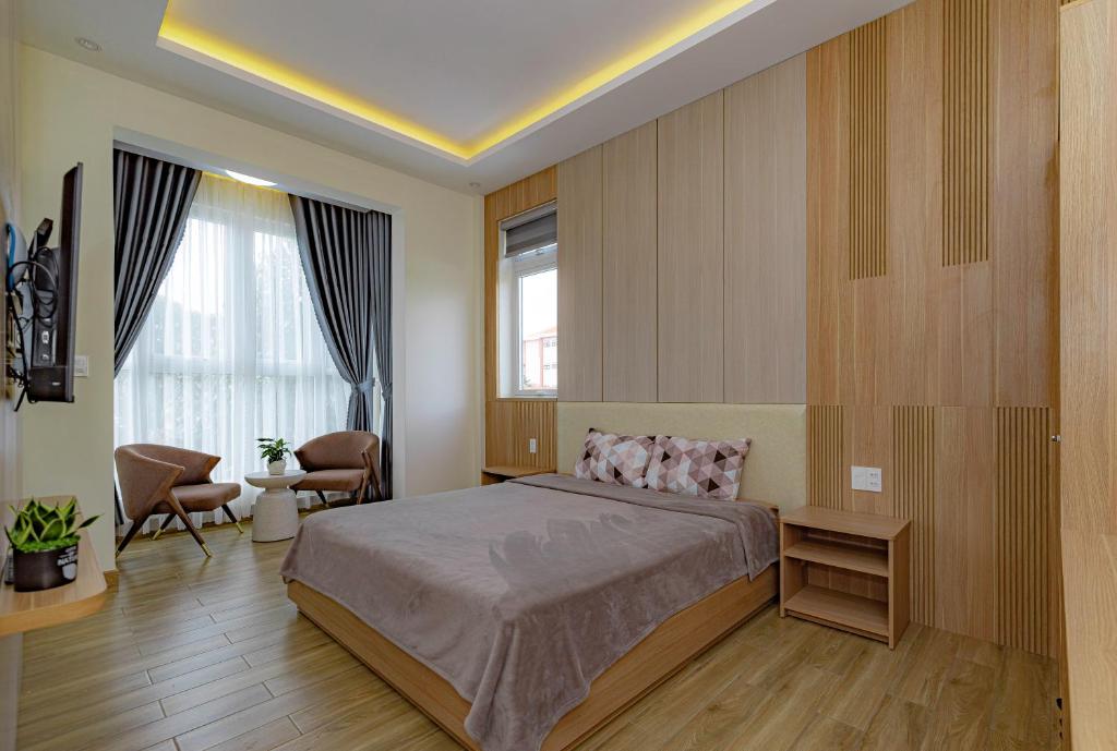 Giường trong phòng chung tại An Mai Boutique Hotel