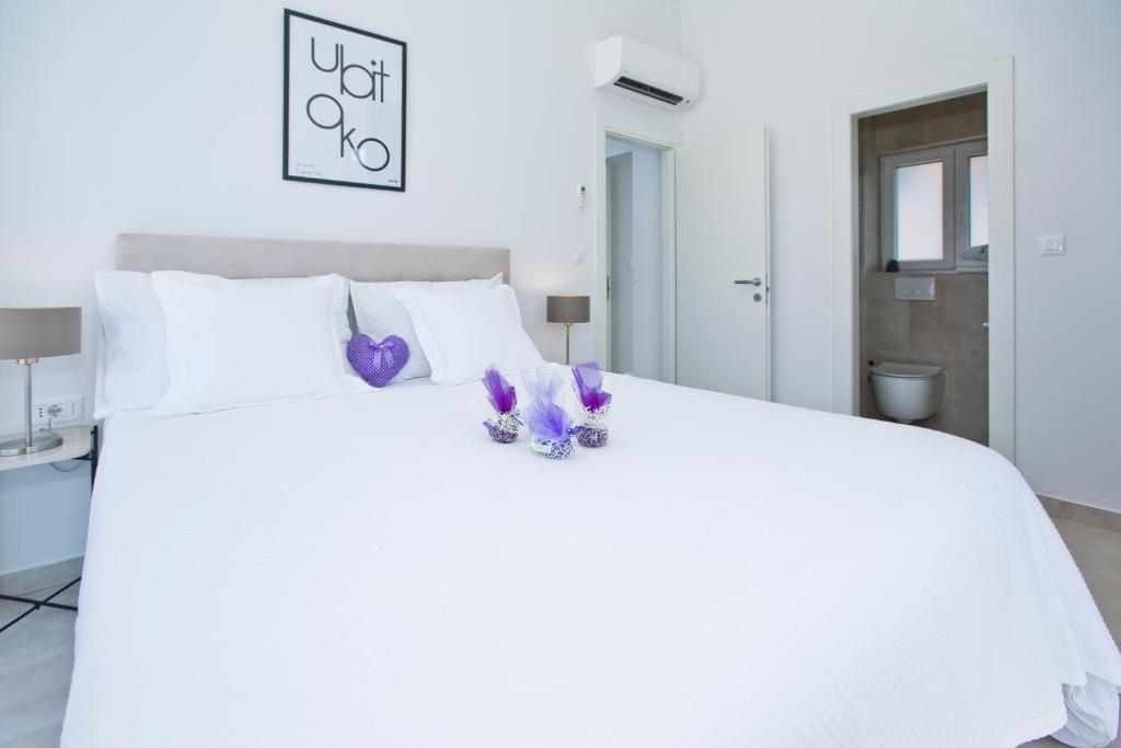 Łóżko lub łóżka w pokoju w obiekcie La Siesta - ZF Hvar