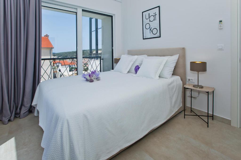 Łóżko lub łóżka w pokoju w obiekcie La Siesta - ZF Hvar