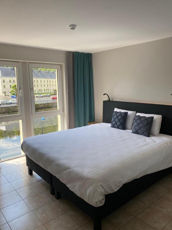 Postel nebo postele na pokoji v ubytování Hotel LA PLAGE