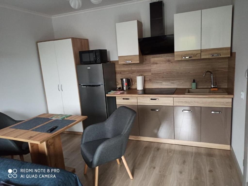 Kuchyňa alebo kuchynka v ubytovaní Pokoje Gościnne Finezja