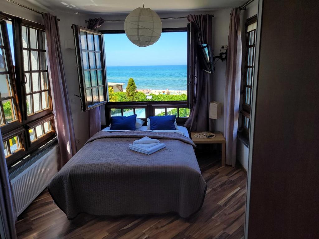 Postel nebo postele na pokoji v ubytování Dom Przy Plaży