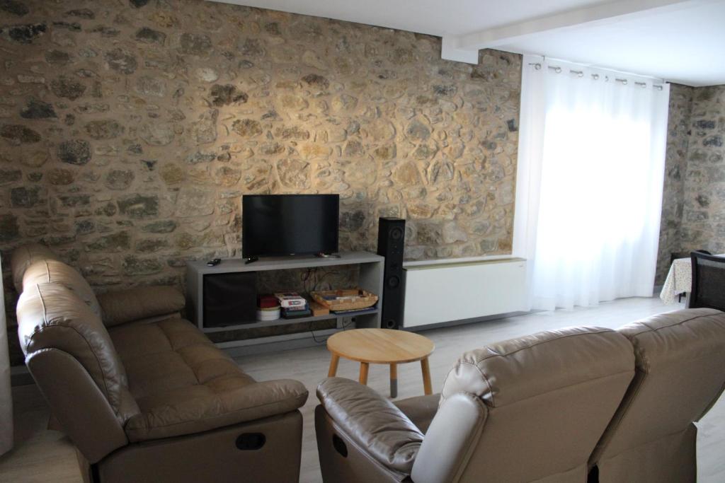 TV a/nebo společenská místnost v ubytování Can Musiquem amb Piscina