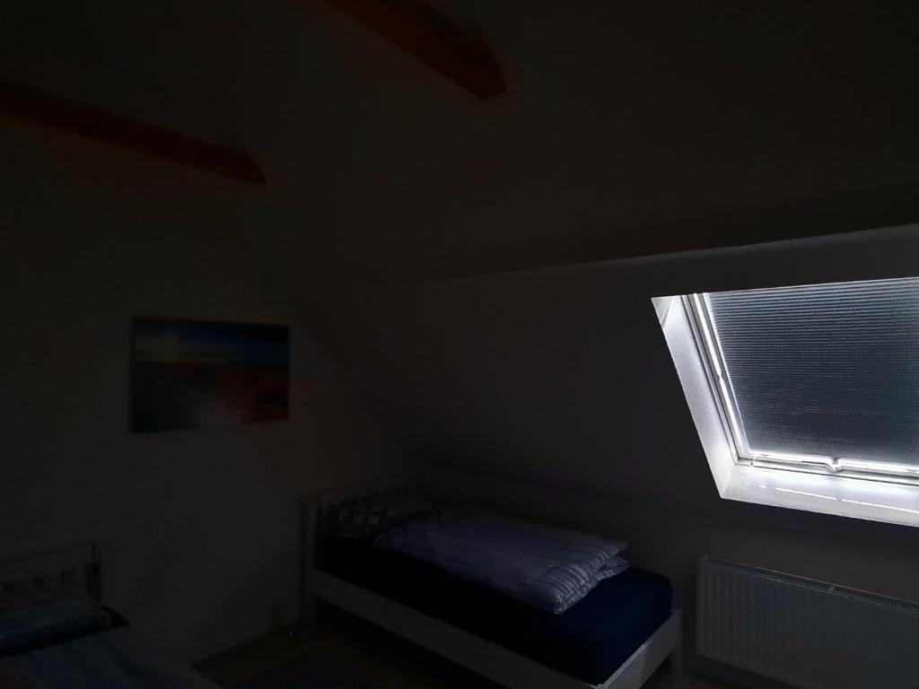 Postel nebo postele na pokoji v ubytování Leuchtturm Emden