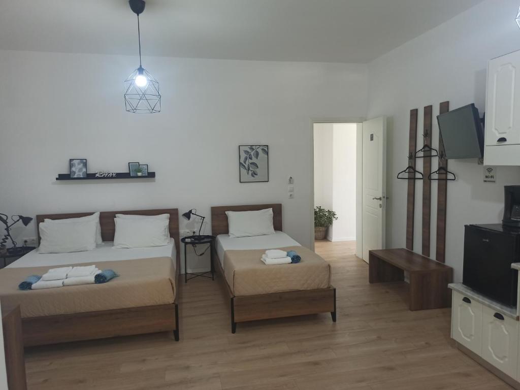 Uma cama ou camas num quarto em Bourbos Summer Rooms