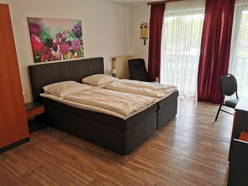 Posteľ alebo postele v izbe v ubytovaní Zur Mühle