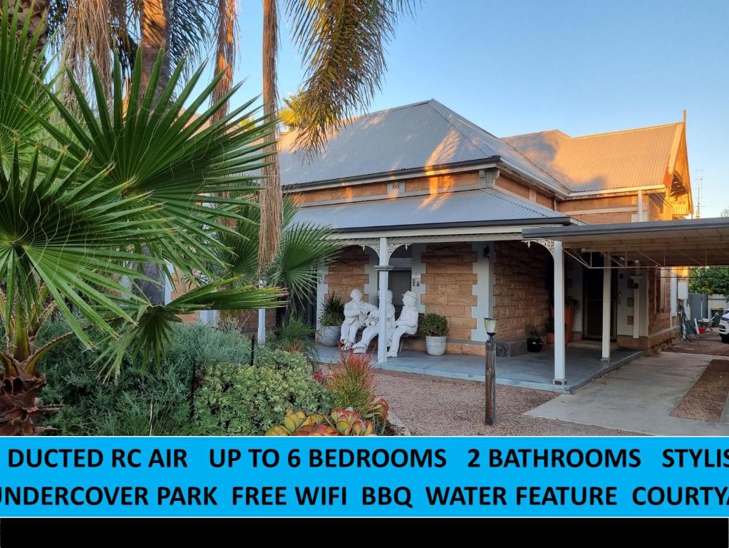 a house with a sign that readsued rep air up to bedrooms at The Atrium - A Stylish Home with up to 6 Bedrooms in Port Pirie