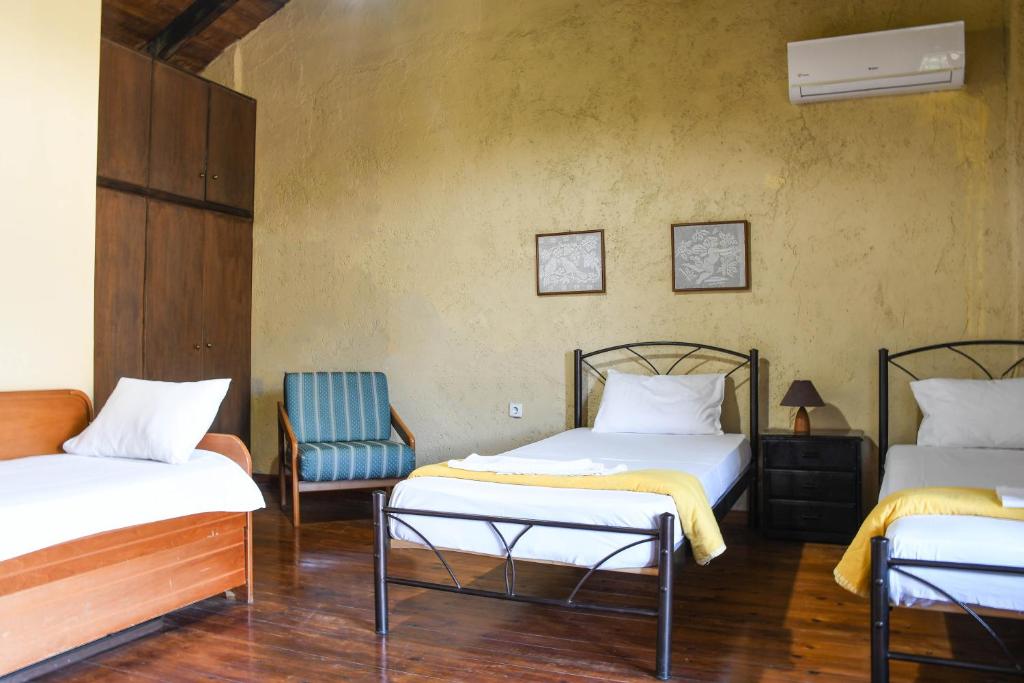 Postel nebo postele na pokoji v ubytování Velanos Villas