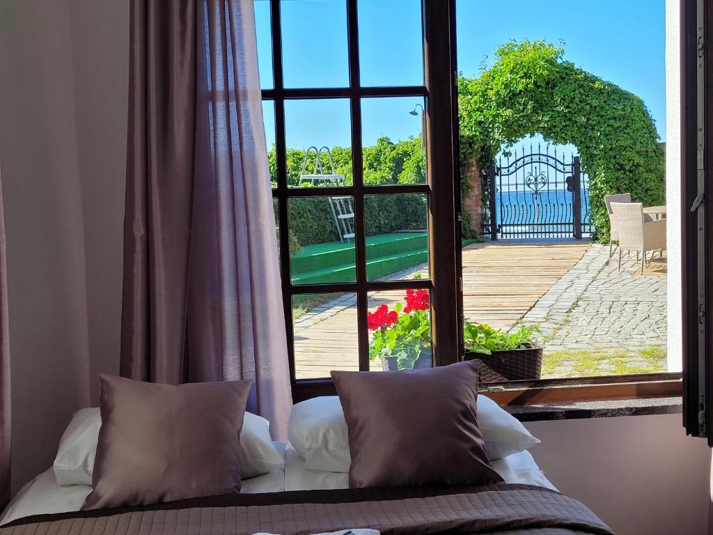 Postel nebo postele na pokoji v ubytování Dom Przy Plaży