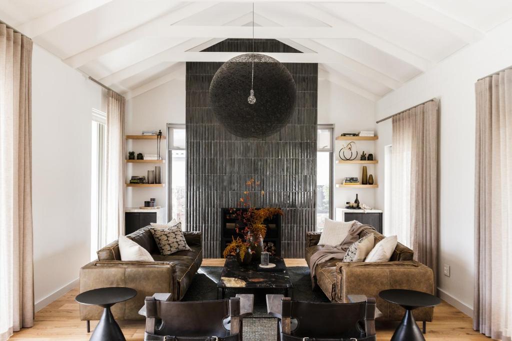 a living room with a couch and chairs at White Pearl in Hermanus