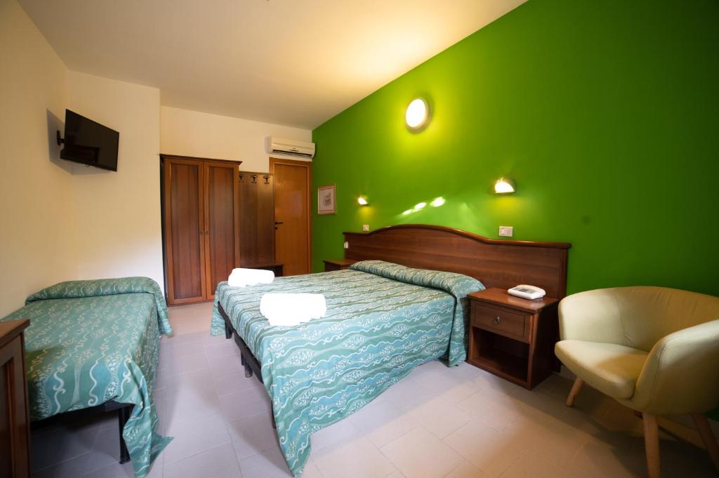 Postel nebo postele na pokoji v ubytování Hotel Villa A Mare