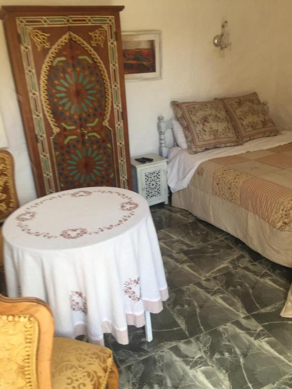 Postel nebo postele na pokoji v ubytování Palais d'hôtes