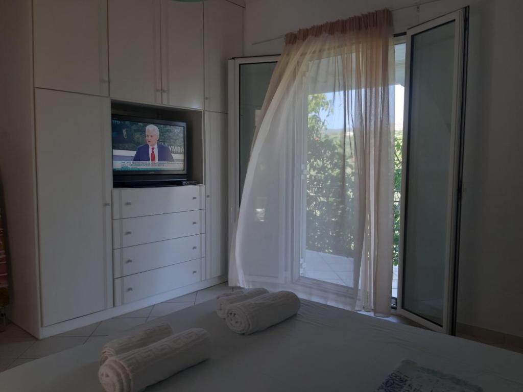Televízia a/alebo spoločenská miestnosť v ubytovaní Konstantina's House I