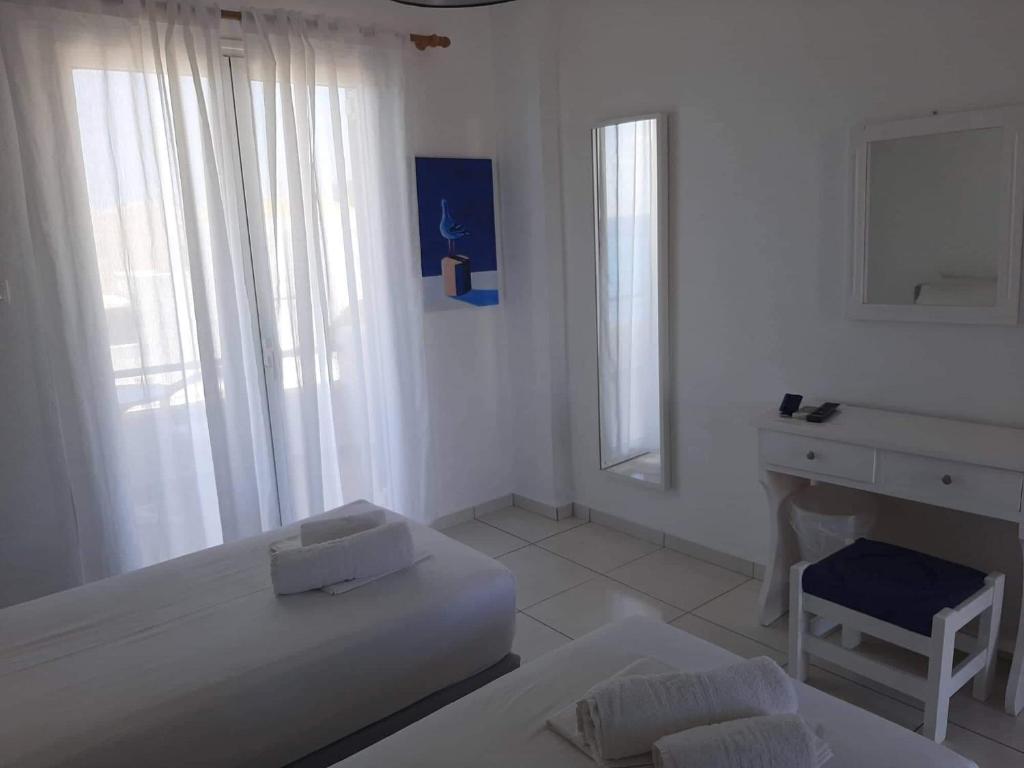 Postel nebo postele na pokoji v ubytování Seaside Studios