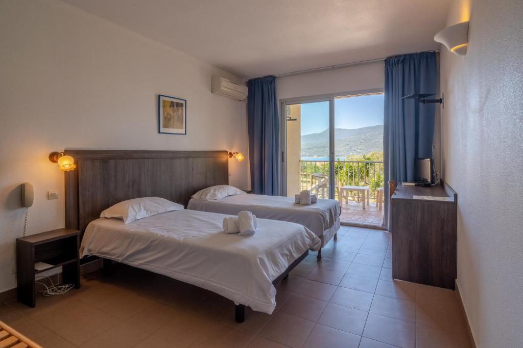 Postel nebo postele na pokoji v ubytování Hotel Hibiscus