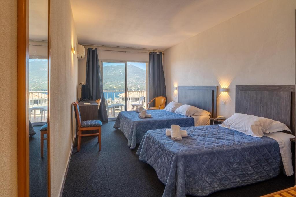 Postel nebo postele na pokoji v ubytování Hotel Hibiscus