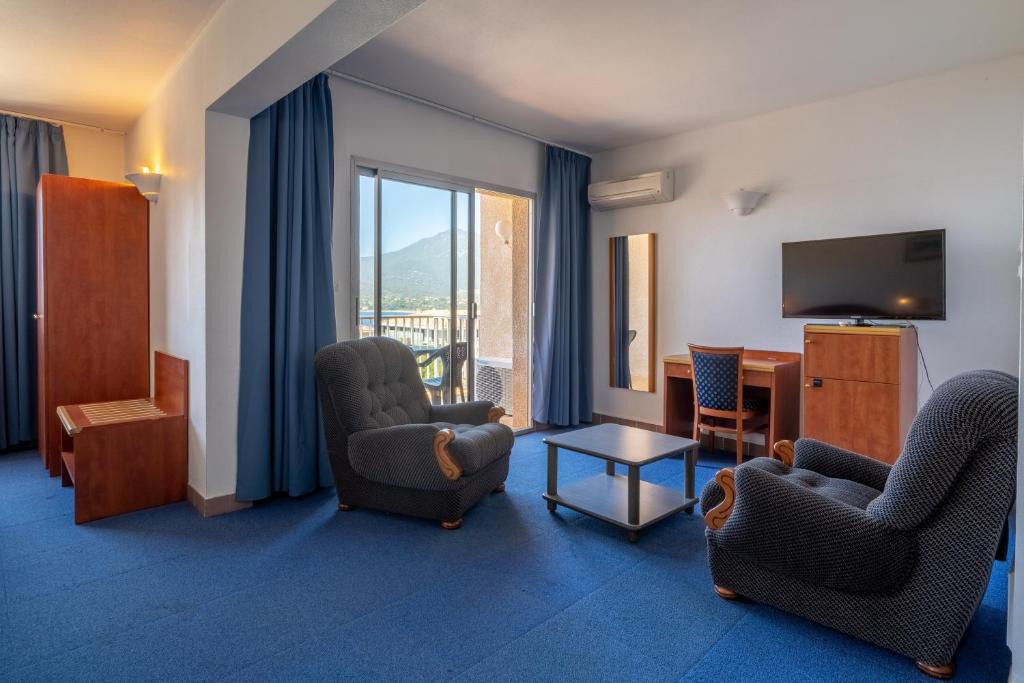 TV a/nebo společenská místnost v ubytování Hotel Hibiscus