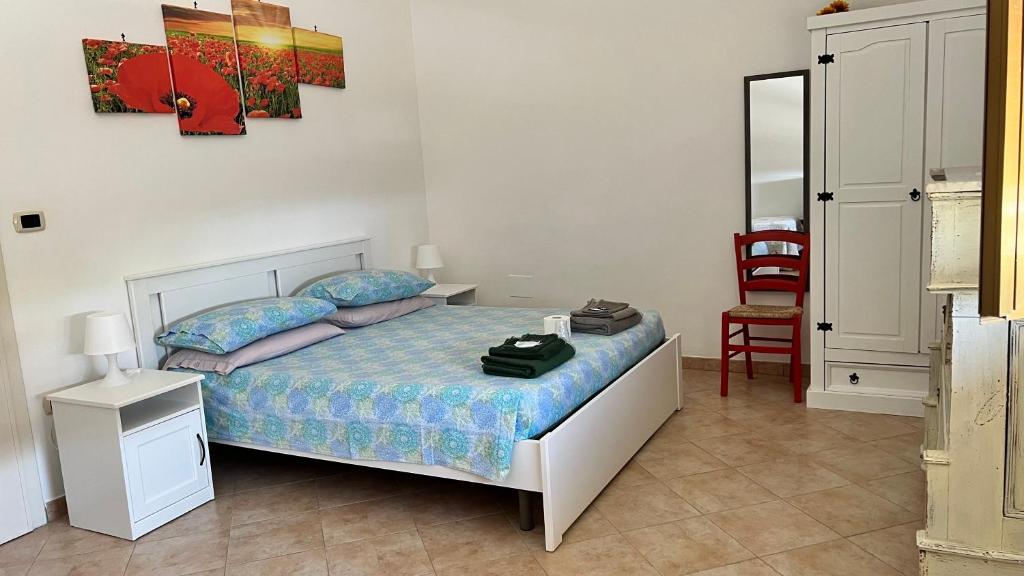 Postel nebo postele na pokoji v ubytování B&B Giglio Marino