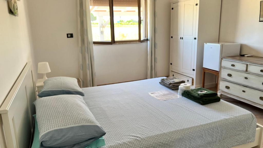 Postel nebo postele na pokoji v ubytování B&B Giglio Marino