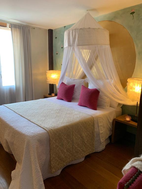 Postel nebo postele na pokoji v ubytování Hotel Boutique Valle de Oca