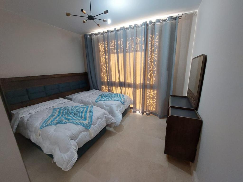 Postel nebo postele na pokoji v ubytování MCJ Luxury 2 Bedrooms Apartment