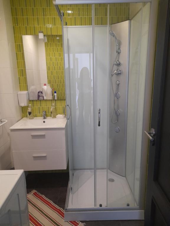 a bathroom with a shower and a sink at Villa Alegria in Ericeira