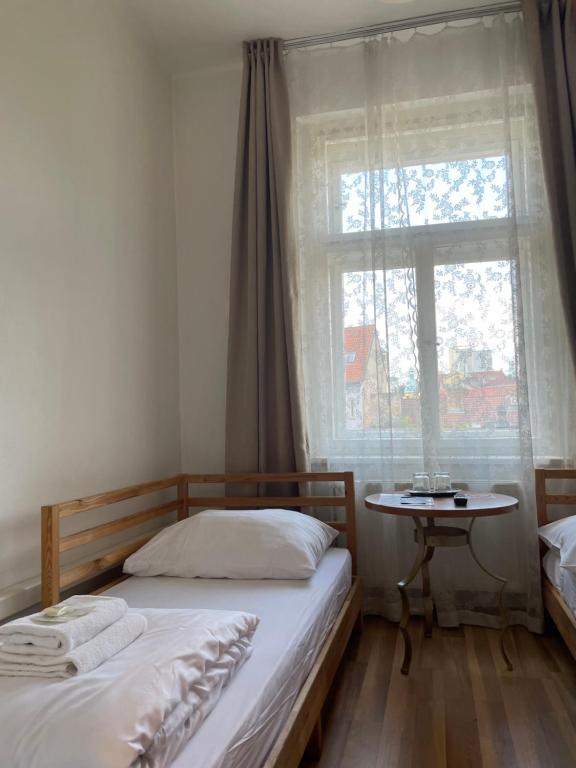 Postel nebo postele na pokoji v ubytování Gallery Hotel SIS