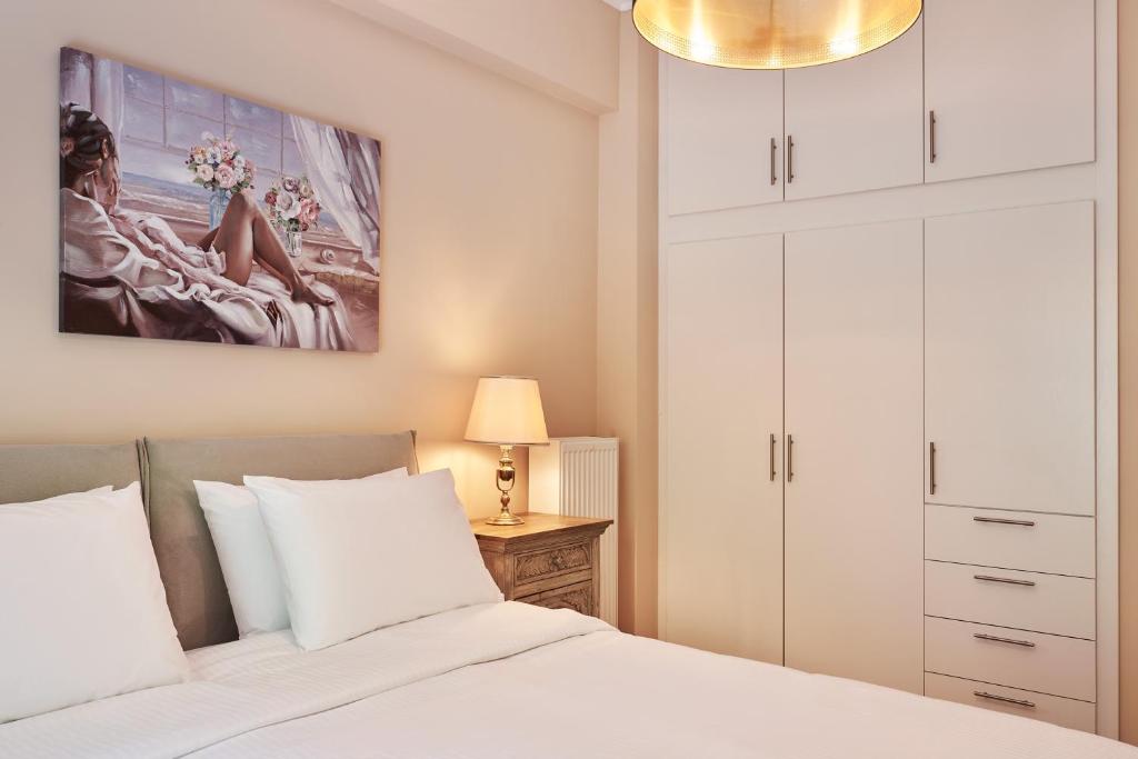 Posteľ alebo postele v izbe v ubytovaní Spirou Merkouri Handcrafted 2BD Home
