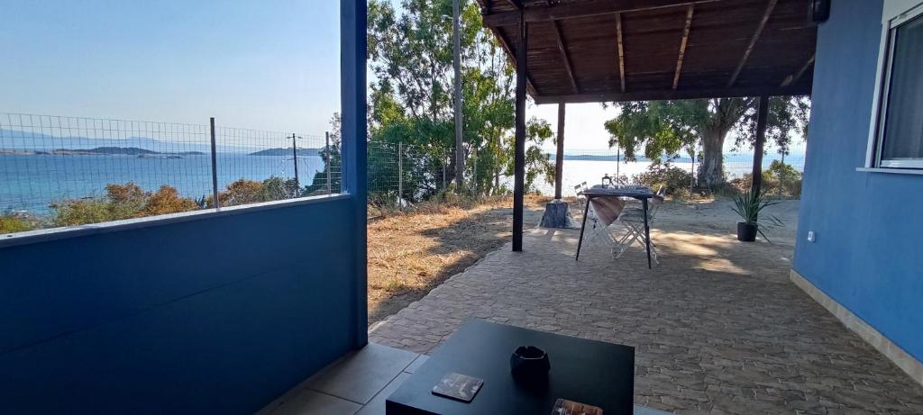 a room with a view of the ocean from a house at Ouranoupolis View Point in Ouranoupoli