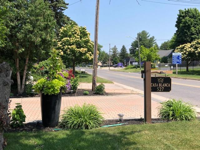 a sign on the side of a road next to a street at Casa Blanca Boutique Bed & Breakfast in Niagara-on-the-Lake