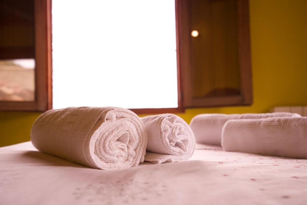 A bed or beds in a room at El Cau de Corcolilla (Villa Rural)