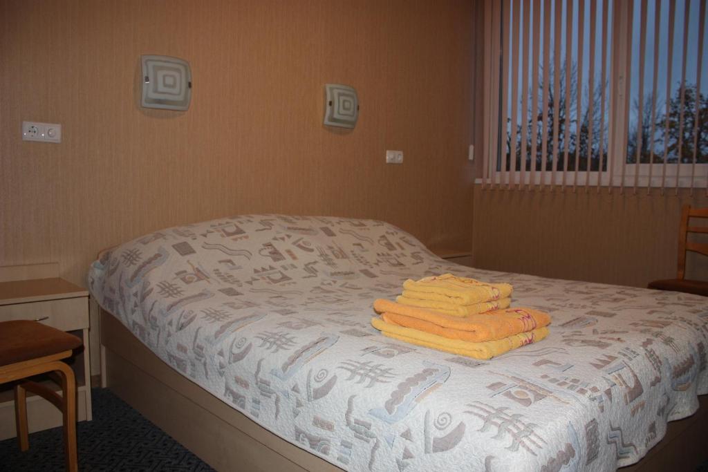 Postel nebo postele na pokoji v ubytování Balvi Hotel