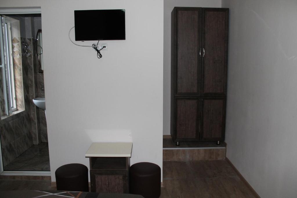 TV a/nebo společenská místnost v ubytování Ponto Hotel