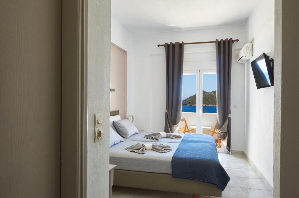 Postel nebo postele na pokoji v ubytování HOTEL ATHINA