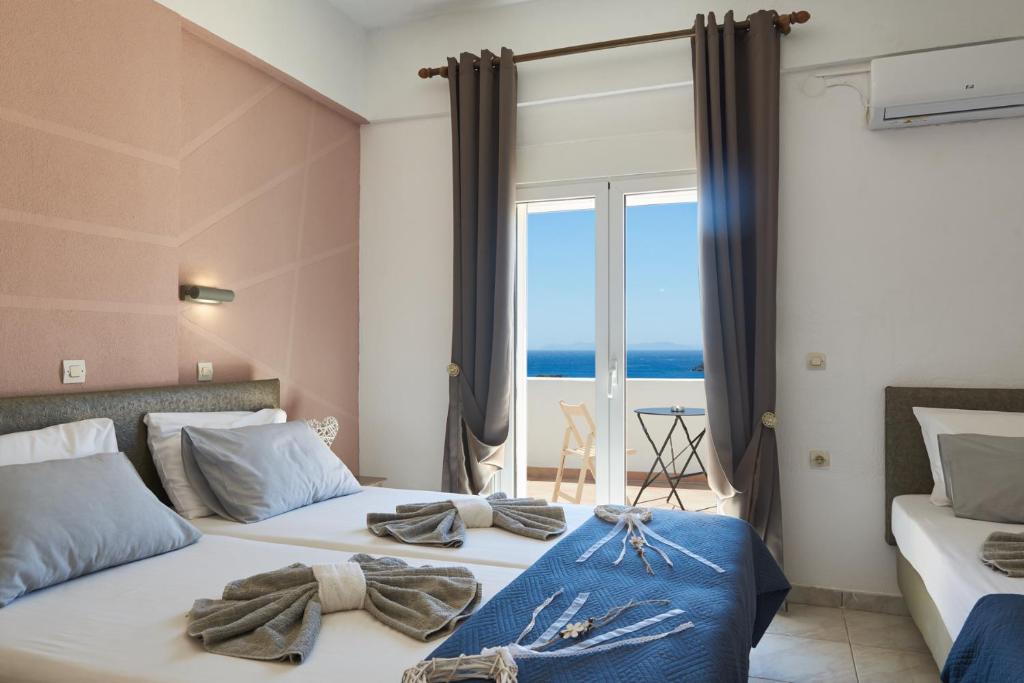 Postel nebo postele na pokoji v ubytování HOTEL ATHINA
