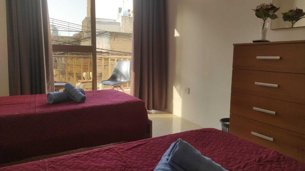 Postel nebo postele na pokoji v ubytování San Salvatore Home