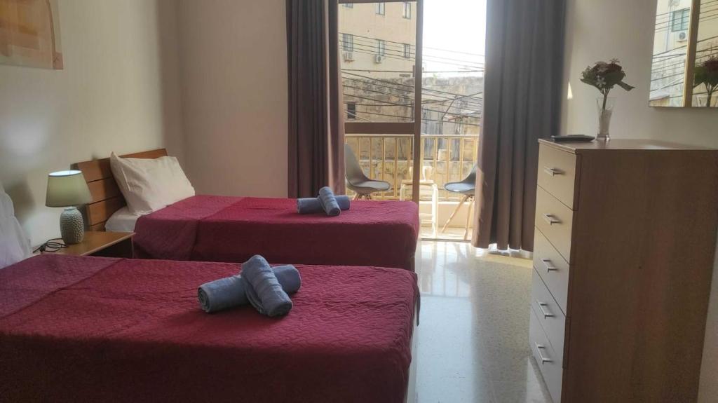 Postel nebo postele na pokoji v ubytování San Salvatore Home