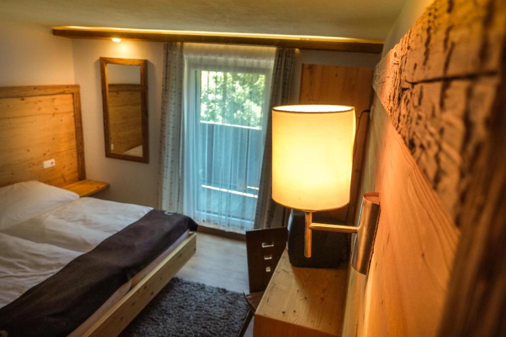 Postel nebo postele na pokoji v ubytování Apart Berghof Steinbock