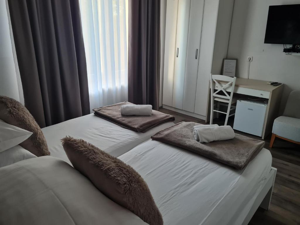 Postel nebo postele na pokoji v ubytování AZUR ROOMS LJUBLJANA