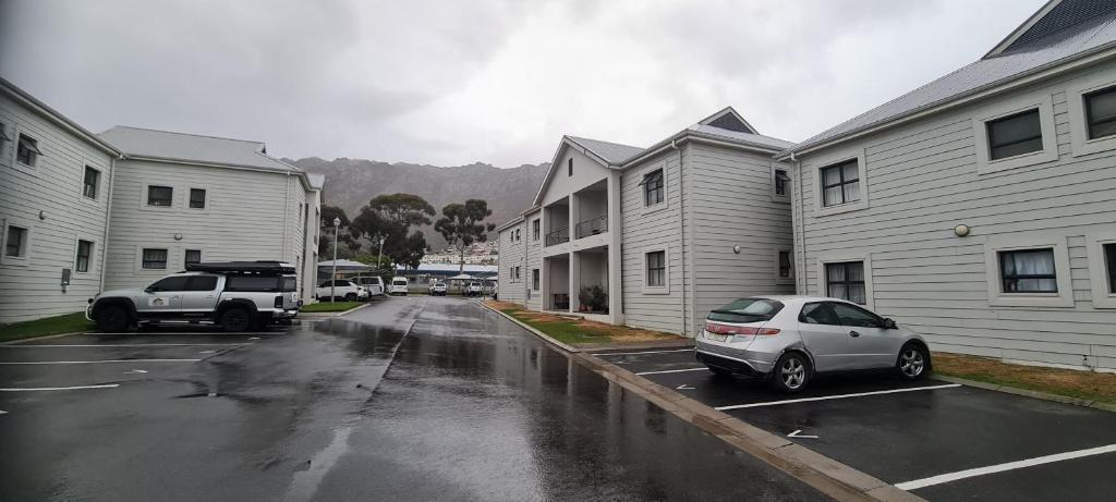 a car parked in a parking lot next to buildings at SEASCAPE MEWS 27 in Cape Town
