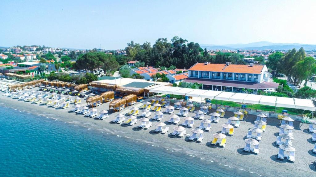 an aerial view of a beach with many sail boats at Teos Ormanci Tatil Koyu in Seferihisar