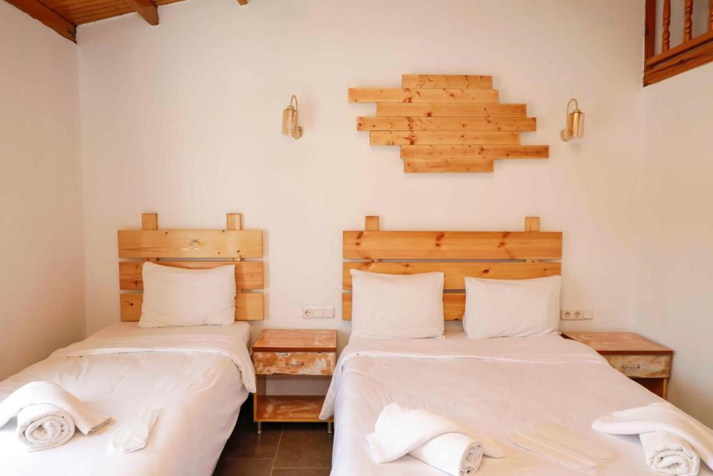 Postel nebo postele na pokoji v ubytování Teos Ormanci Tatil Koyu