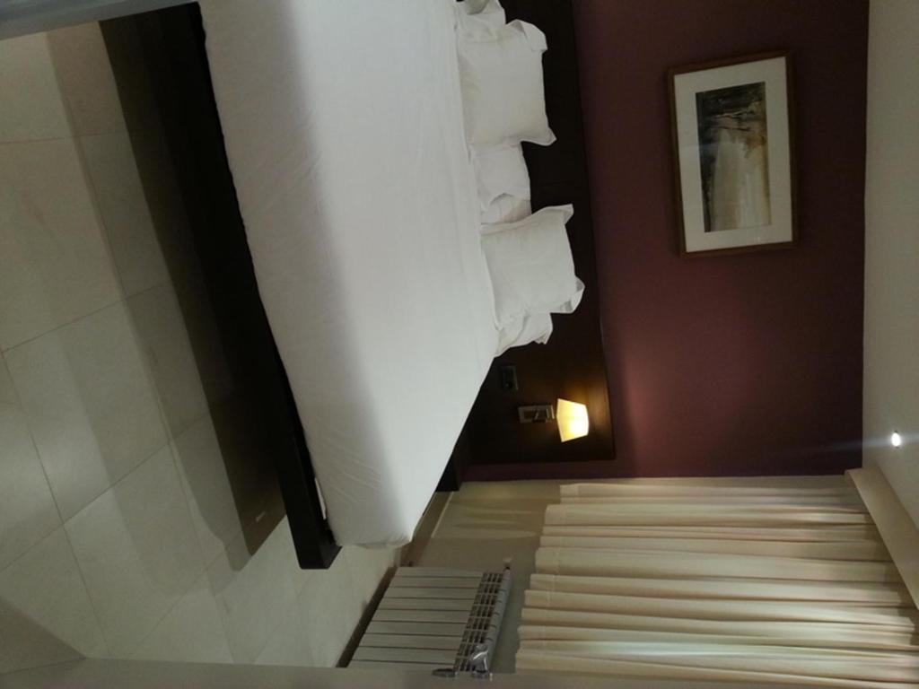 Postel nebo postele na pokoji v ubytování Hotel Can Xiquet