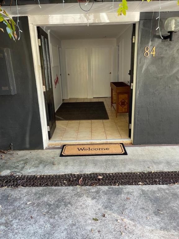 a welcome mat is on the floor of a house at Tamborine Accommodation 84 Eagle Heights Road 6 Bedroom 3 Baths Parking Complete Holiday Home in Mount Tamborine