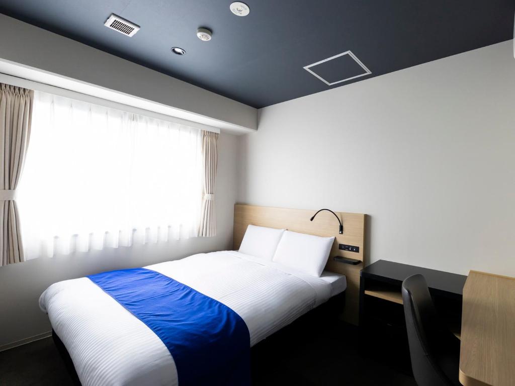 Postel nebo postele na pokoji v ubytování Ariston Hotel Kyoto Jujo