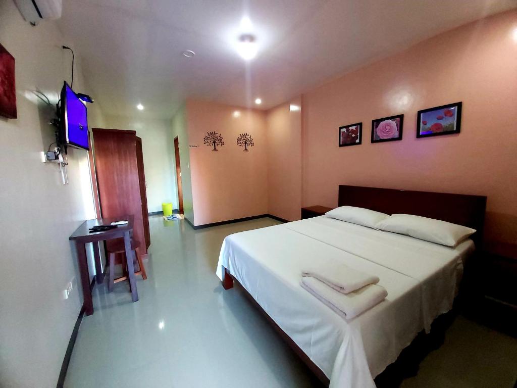 Postel nebo postele na pokoji v ubytování Golden Pension House,Palawan