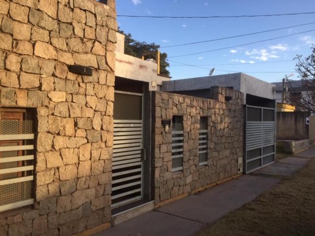 a stone building with two garage doors on the side of it at Casa Norte in La Rioja